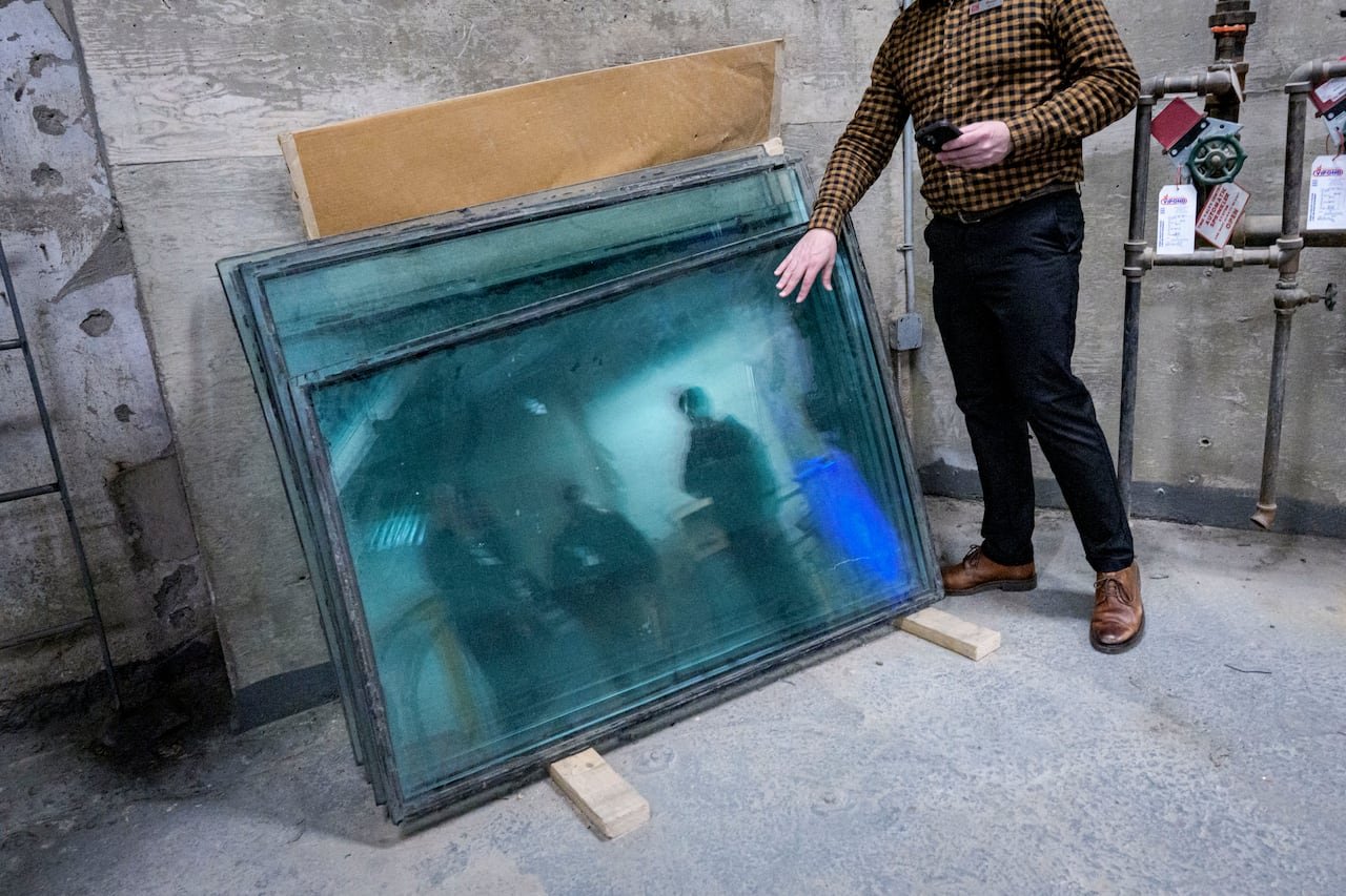 Original glass floor panels stored in basement chamber