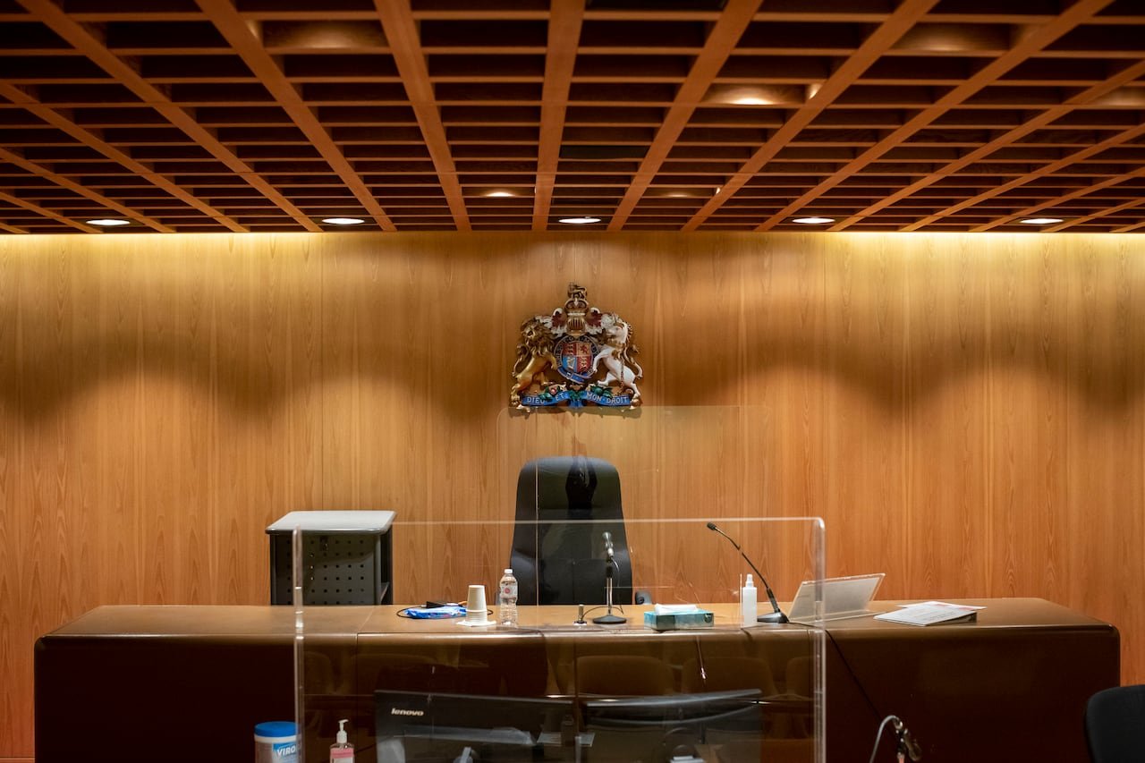Judicial bench featuring B.C Supreme Court emblem symbolizing authority