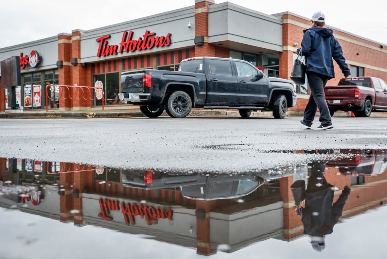 Customers enjoying coffee at newly renovated Tim Hortons location