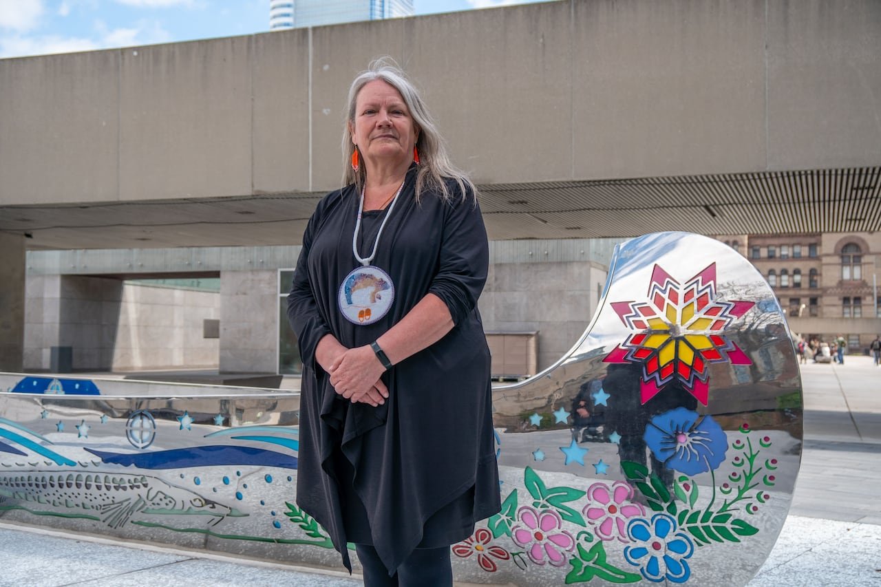Colorful metal canoe sculpture symbolizing resilience