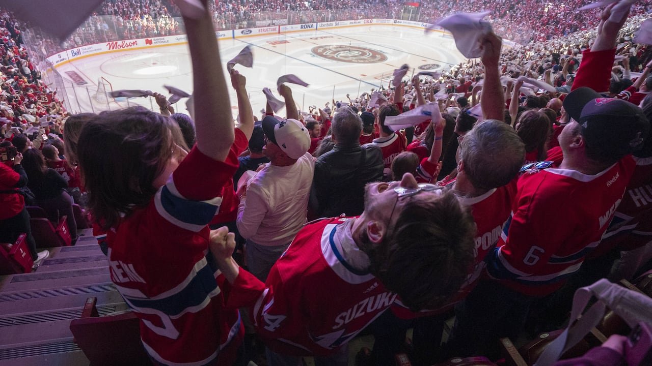 Montreal Canadiens fans cheering loudly inside arena