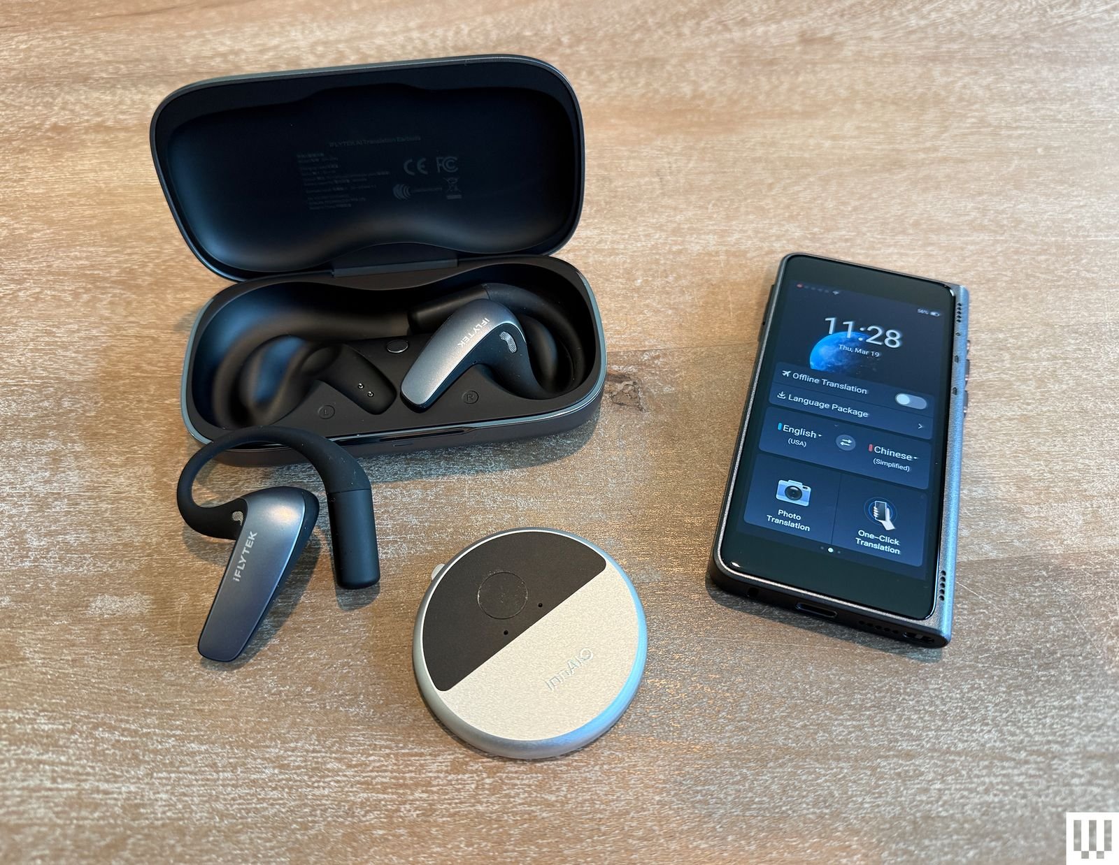 Timekettle T1 portable translator next to smartphone