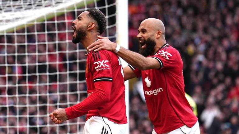matheus Cunha celebrates scoring alongside Bryan Mbeumo
