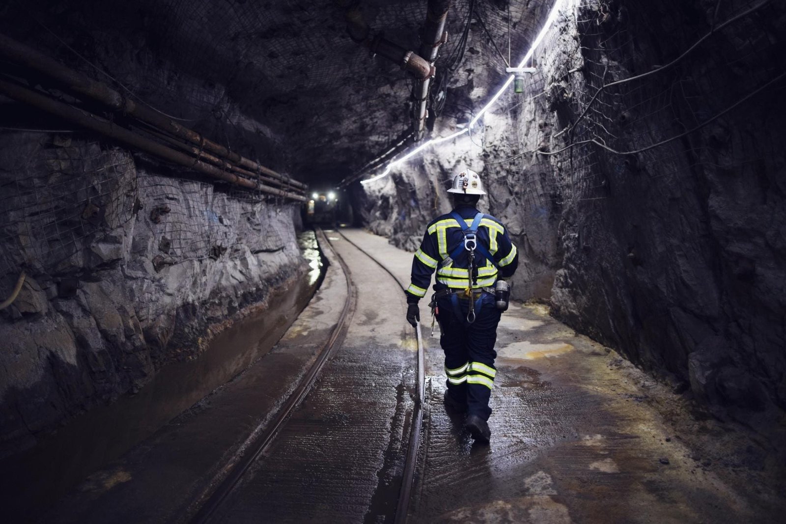 Resolution Copper Underground Worker Walks through a tunnel
