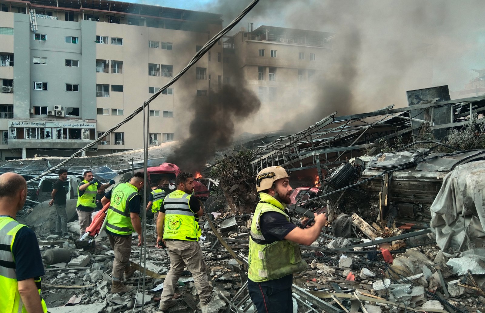 Emergency teams responding to damage from Israeli airstrike in Tyre, Lebanon
