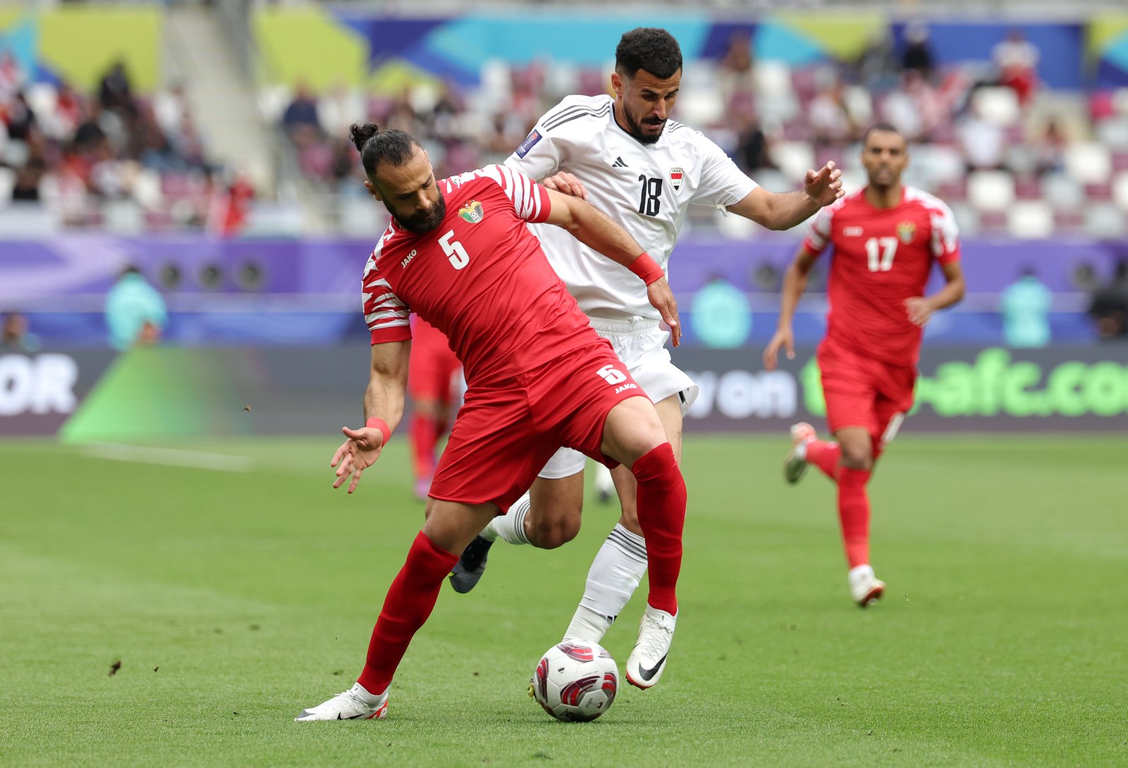 Aymen hussein competing during AFC Asian Cup match