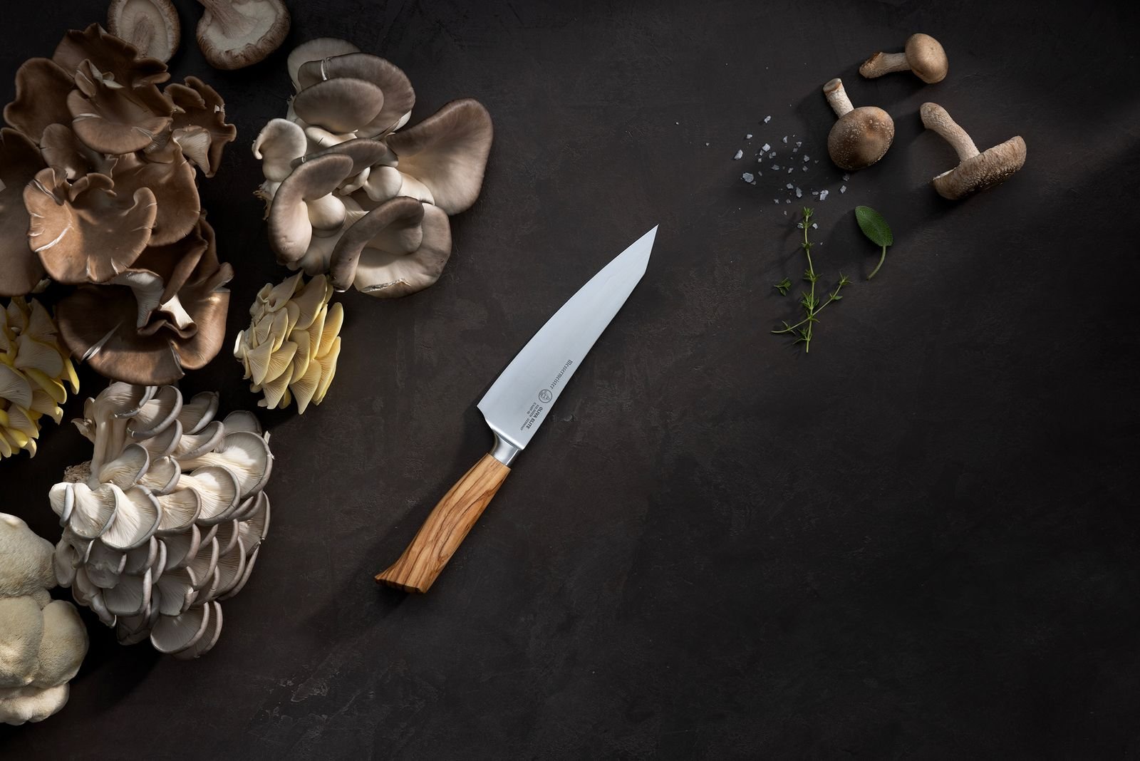 Oliva Elite prepping mushrooms on wooden board