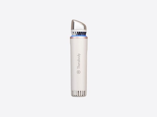 Therabody TheraFace Depuffing wand white cylindrical device silver top