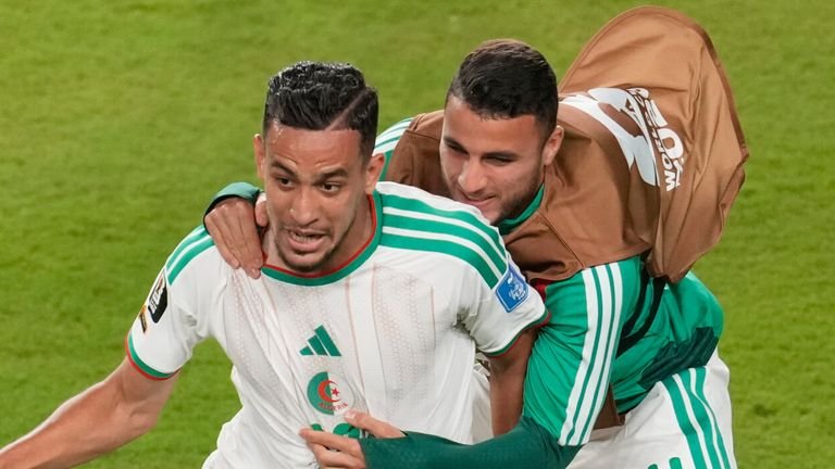 Nadhir Benbouali celebrates after scoring against Jordan