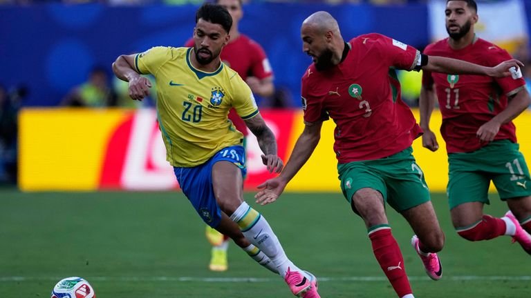Lucas Paqueta contests ball against Noussair Mazraoui