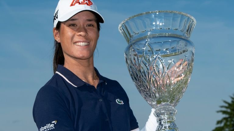 celine ‍Boutier holding trophy after winning