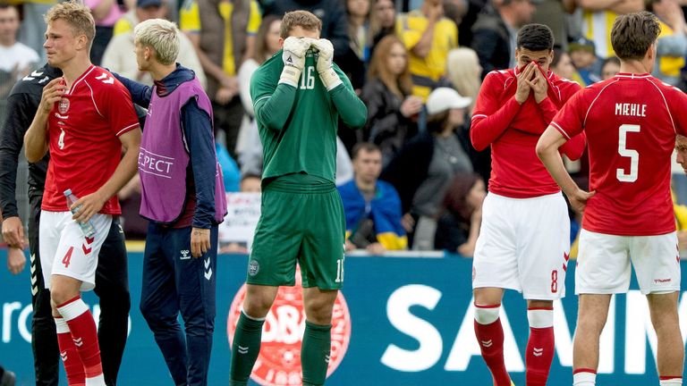 Denmark players visibly emotional after Christian Eriksen collapses during match