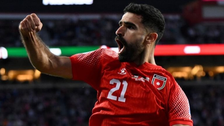 Jordan's Nizar Al Rashdan celebrates his opening goal