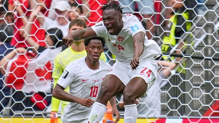 Canada's Promise David celebrates his goal against Switzerland