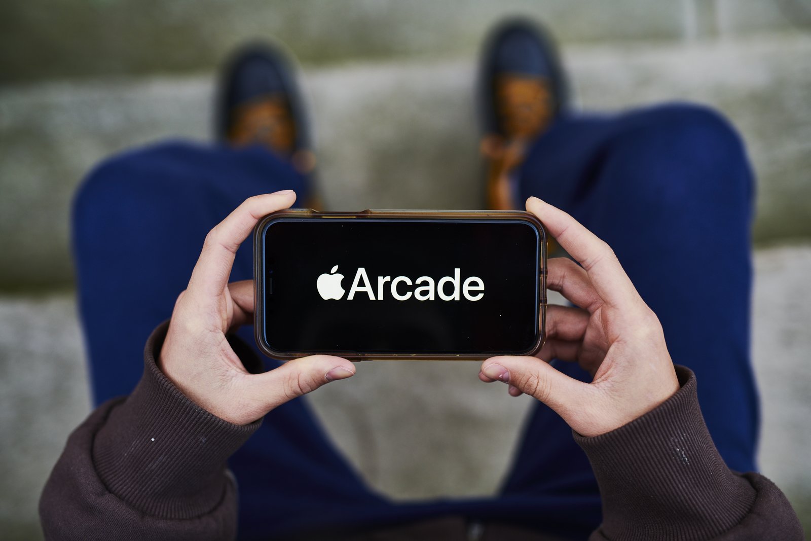 Apple Arcade logo displayed prominently on an iPhone screen
