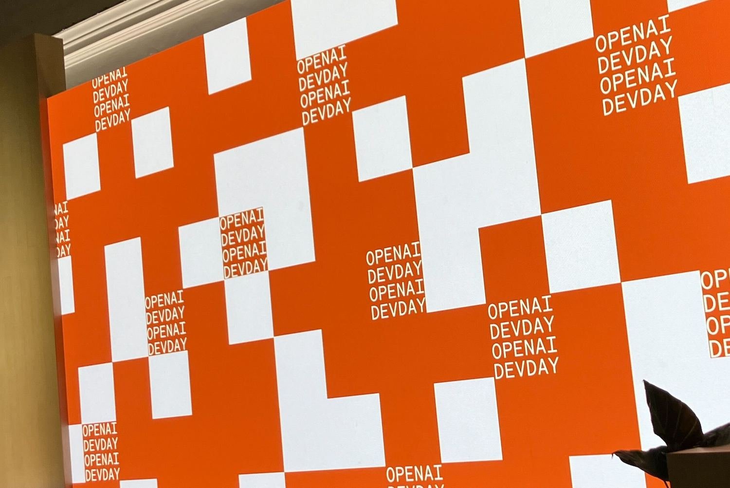 openai logo displayed prominently during developer event
