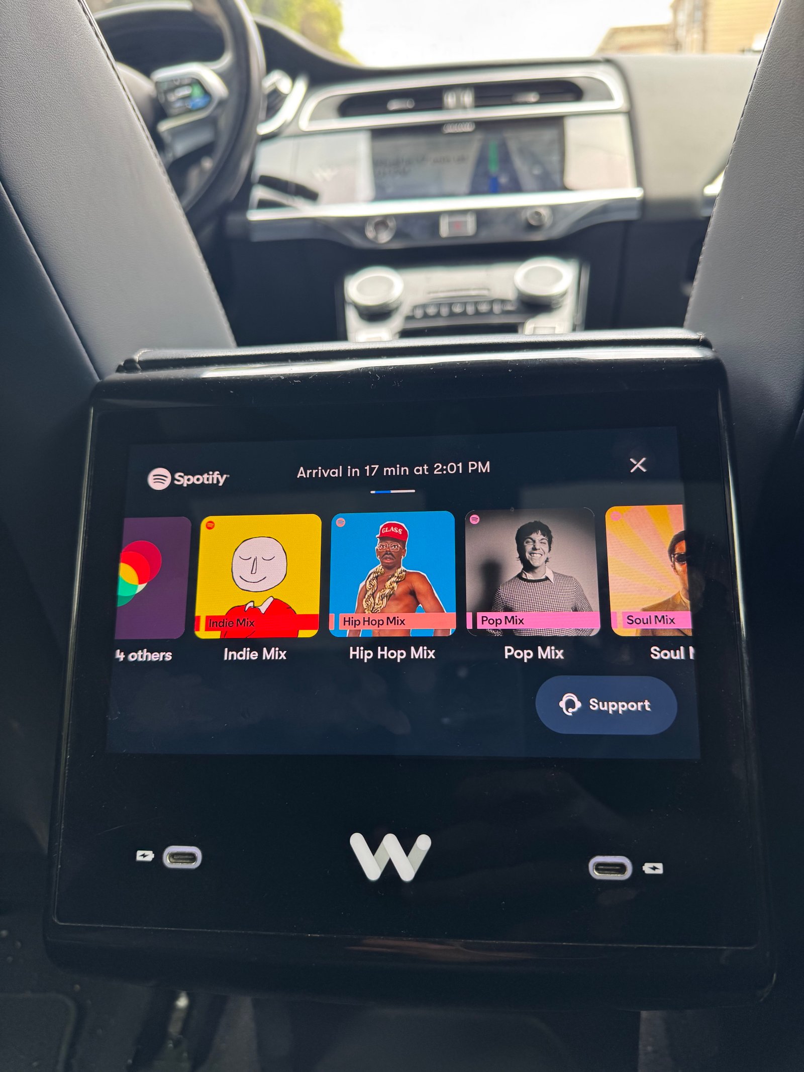 Waymo touchscreen displaying various curated playlists