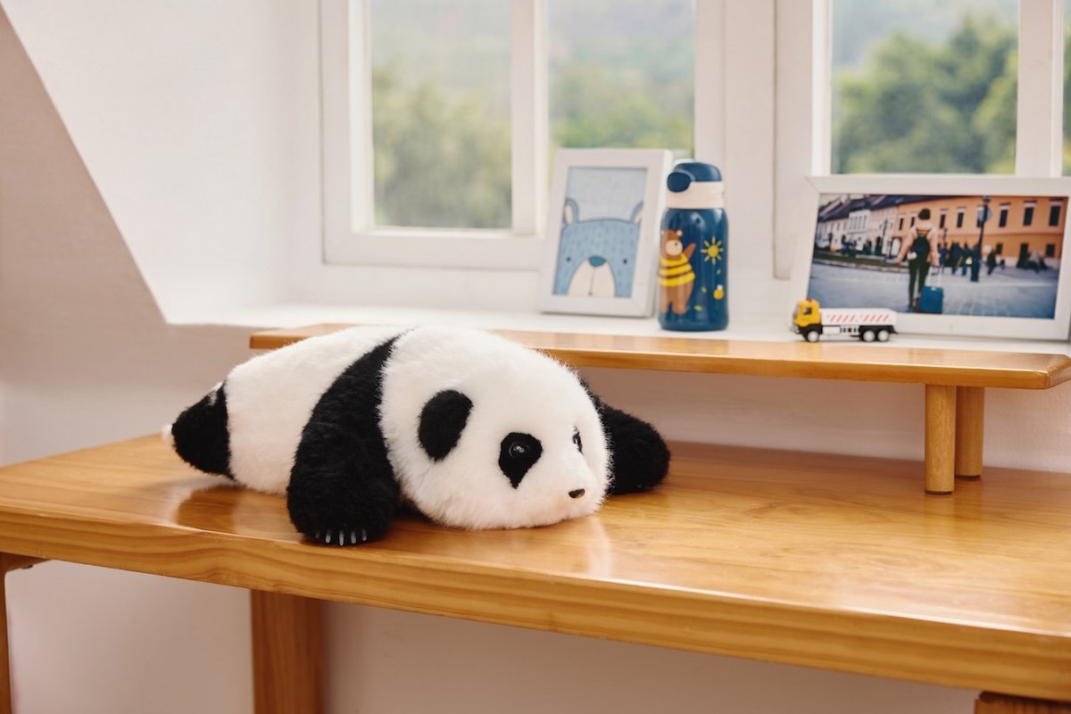 AI Panda an'An resting by window on desk