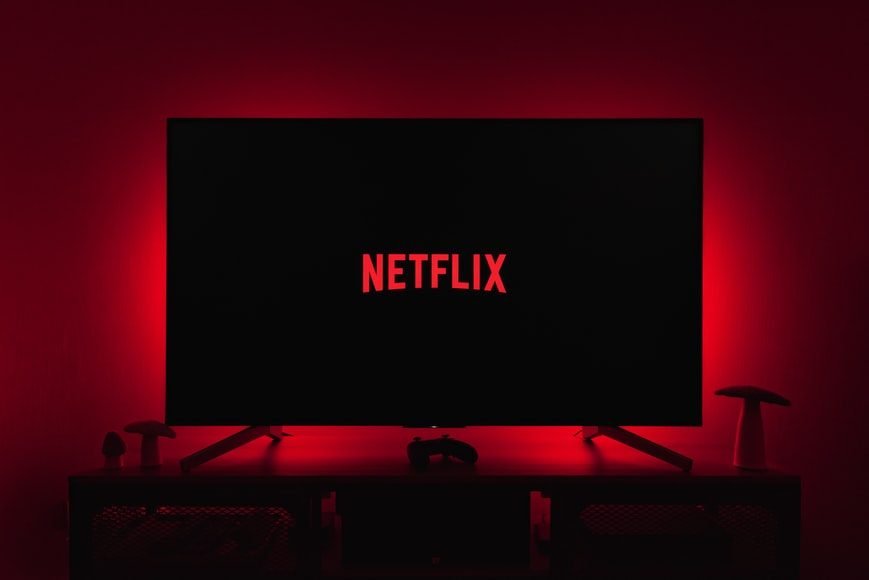 netflix logo glowing red on black background