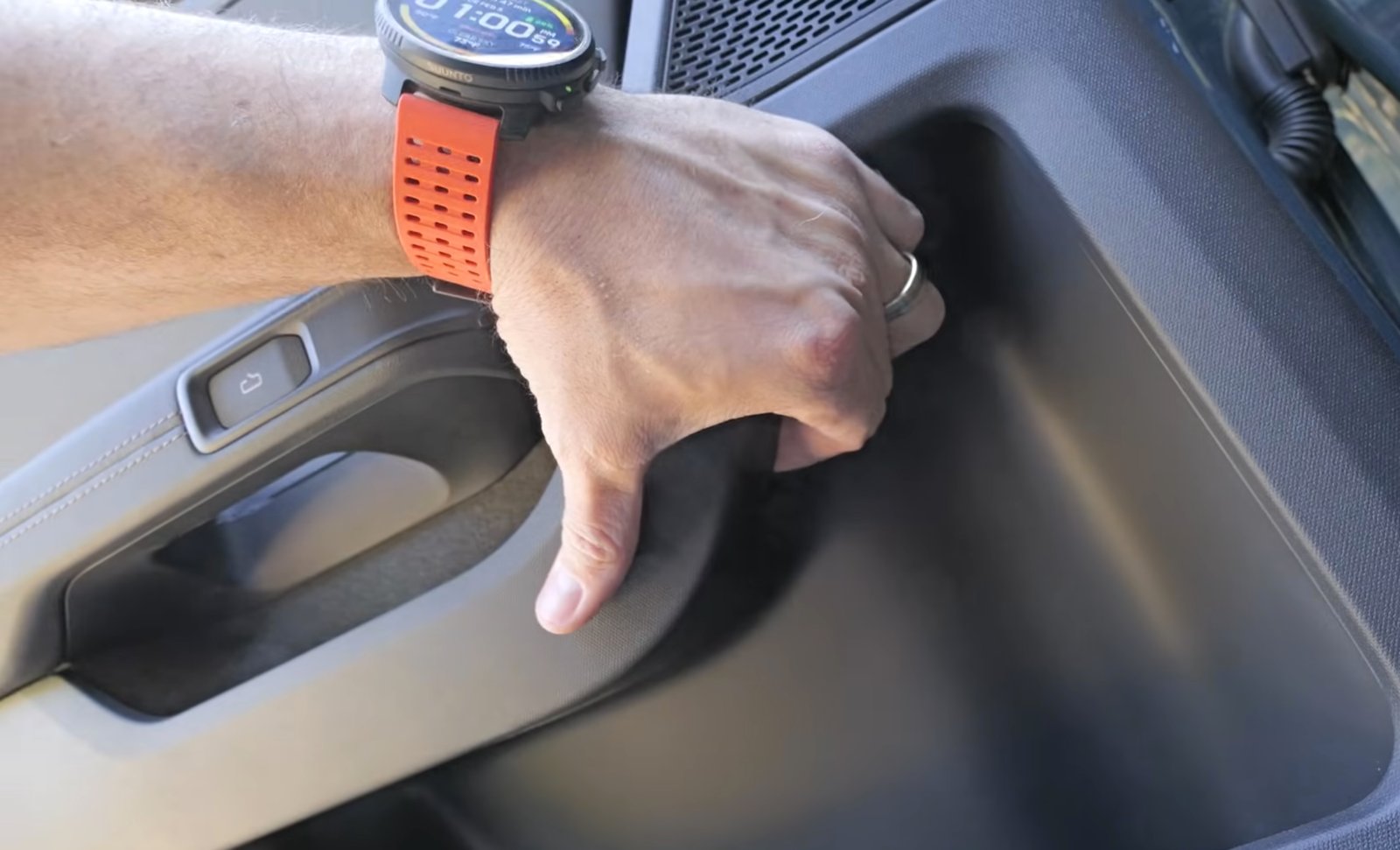 Manual door release mechanism inside Rivian R2 SUV