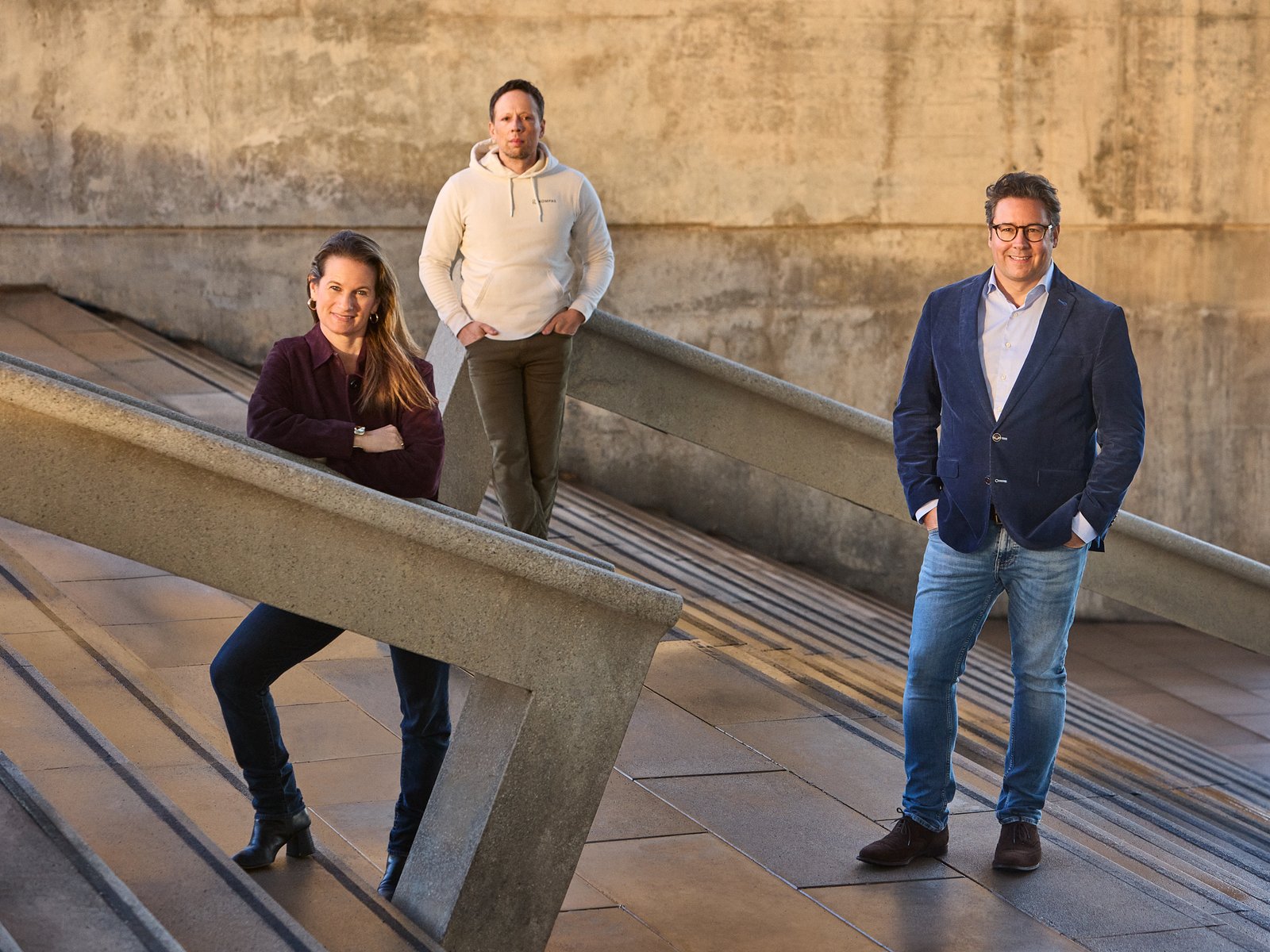 Three professionals collaborating on industrial project