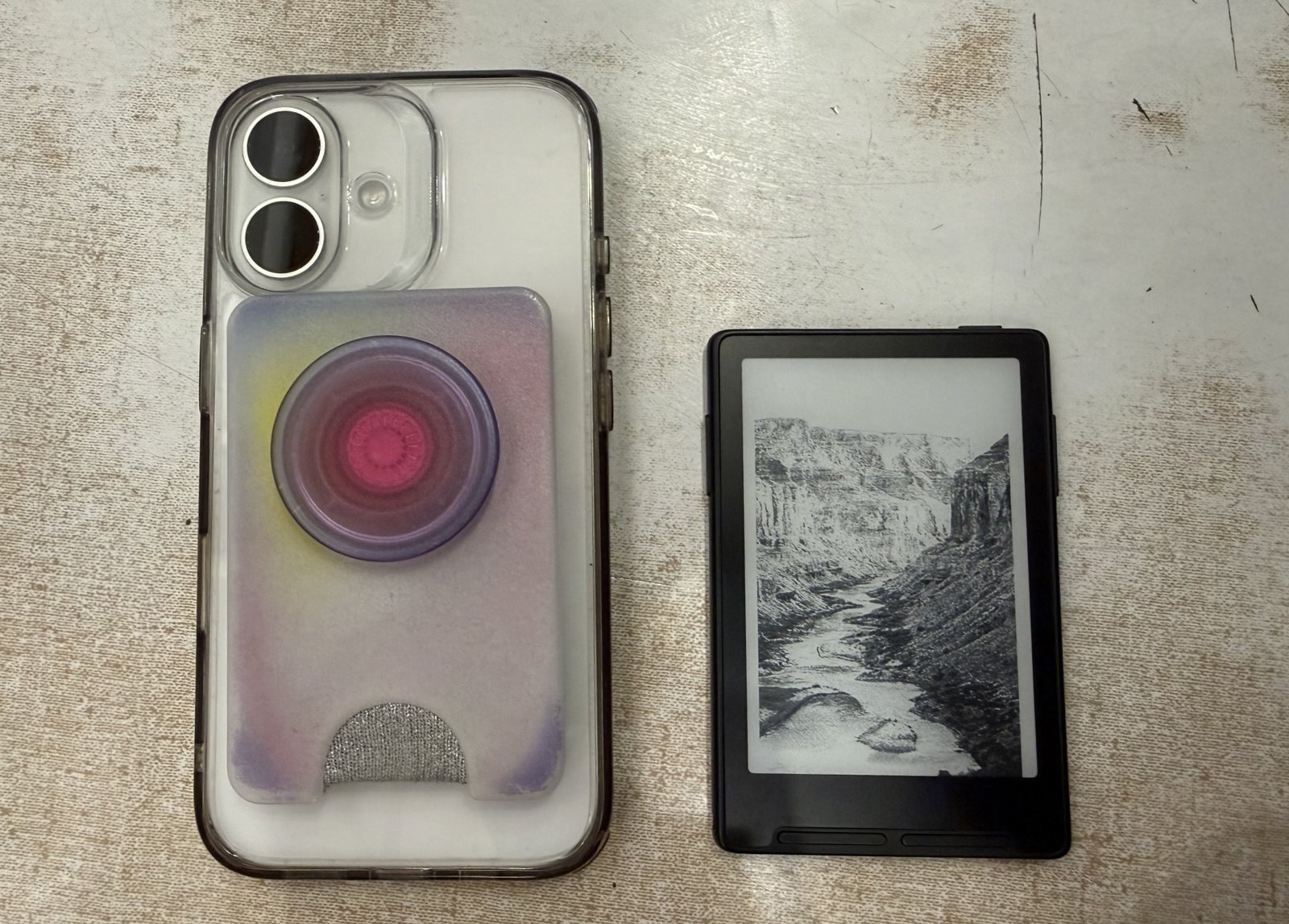 Pop Socket wallet next to Xteink X3