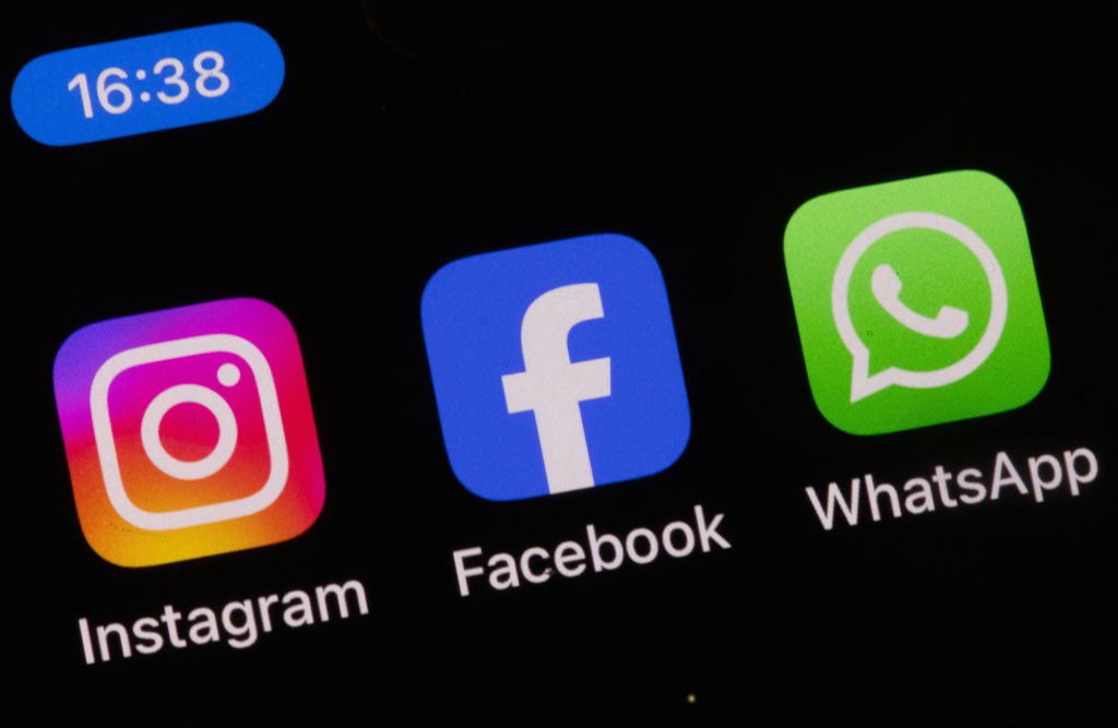 smartphone displaying various social media app interfaces