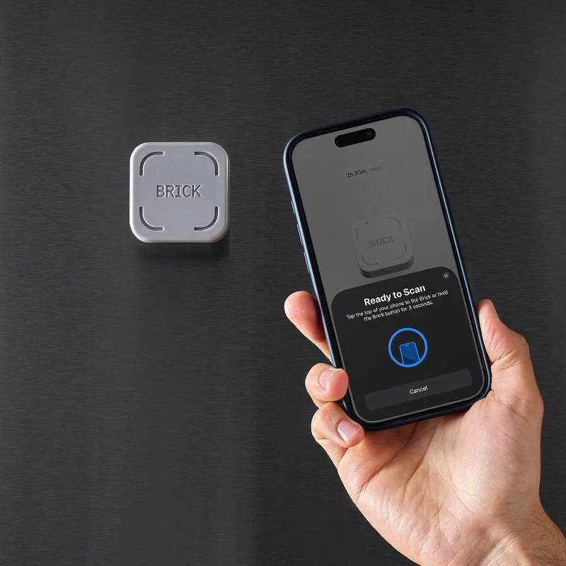 Brick device shown next to smartphone